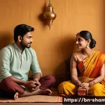 Home 22 무속에서 인간 관계 개선법 - A serene and thoughtful Bengali couple sitting together in a cozy, warmly lit room, engaging in deep...